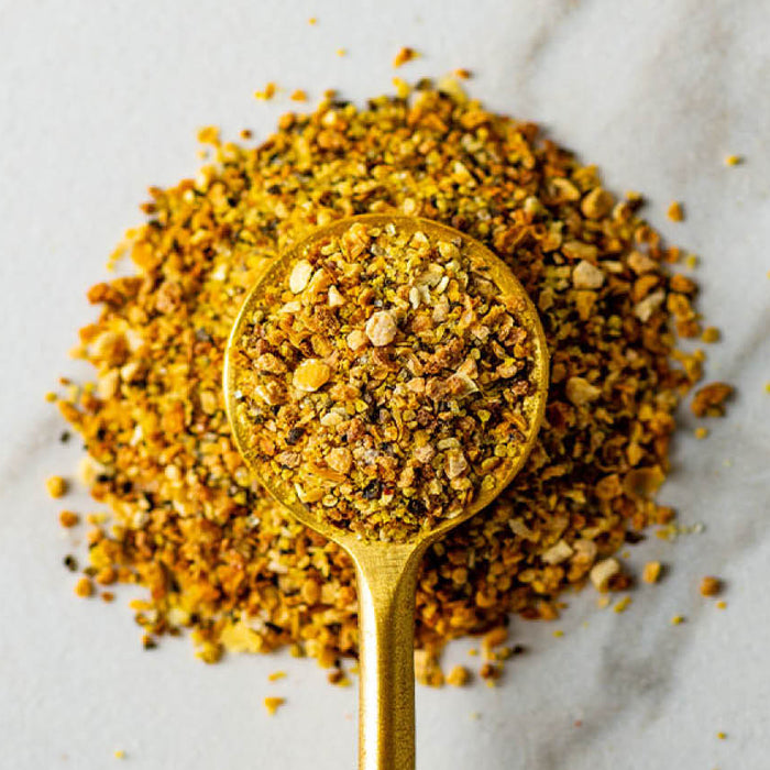 Close up of Pyramid Peak Lemon Pepper in a gold spoon