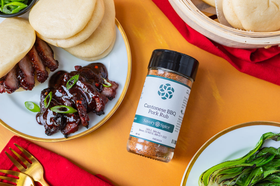 Chinese char siu plate on orange background with jar of Cantonese BBQ Pork Rub