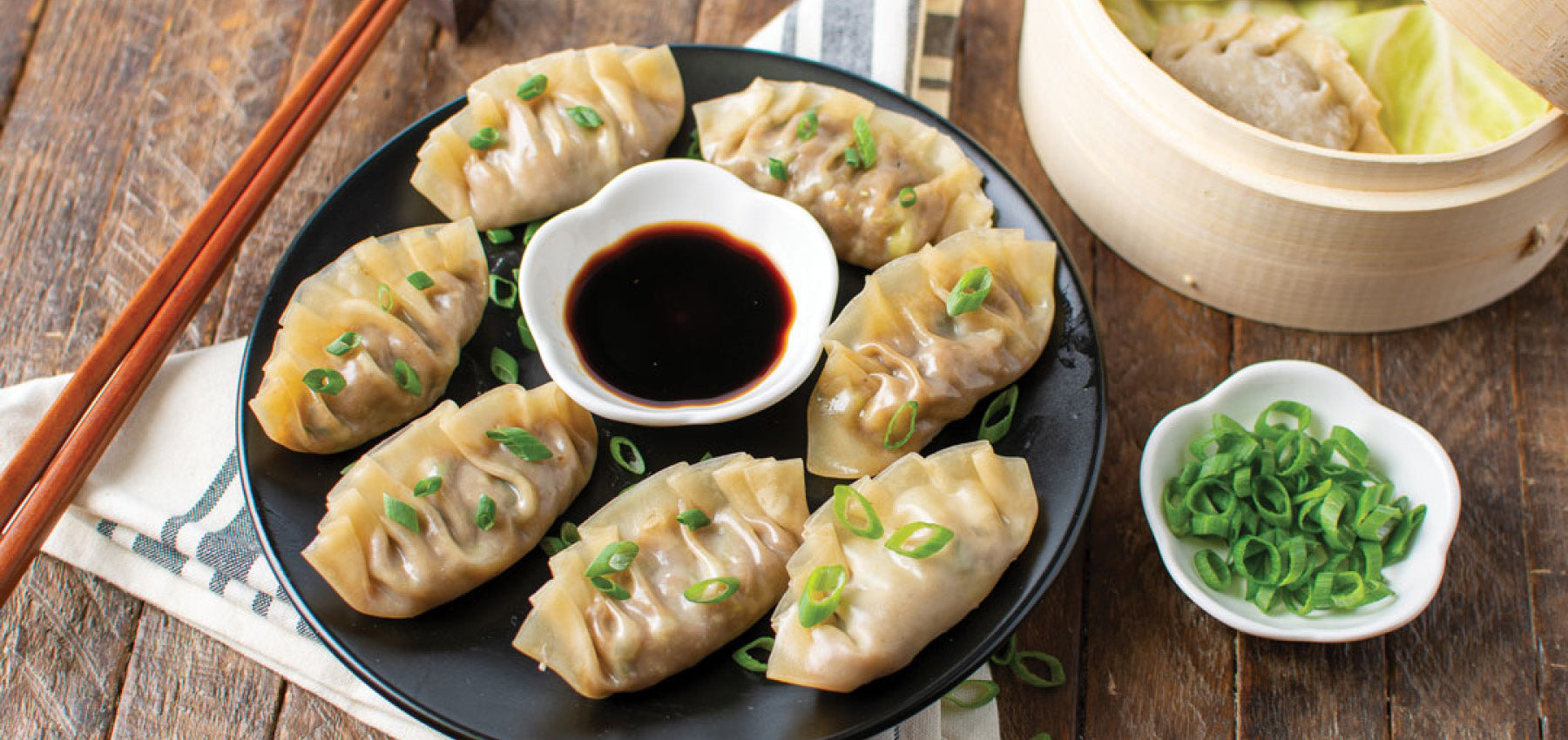 Sweet ginger pork dumplings with green onion and soy sauce