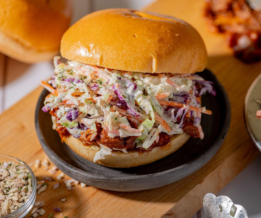 Fried chicken and coleslaw on a bun.